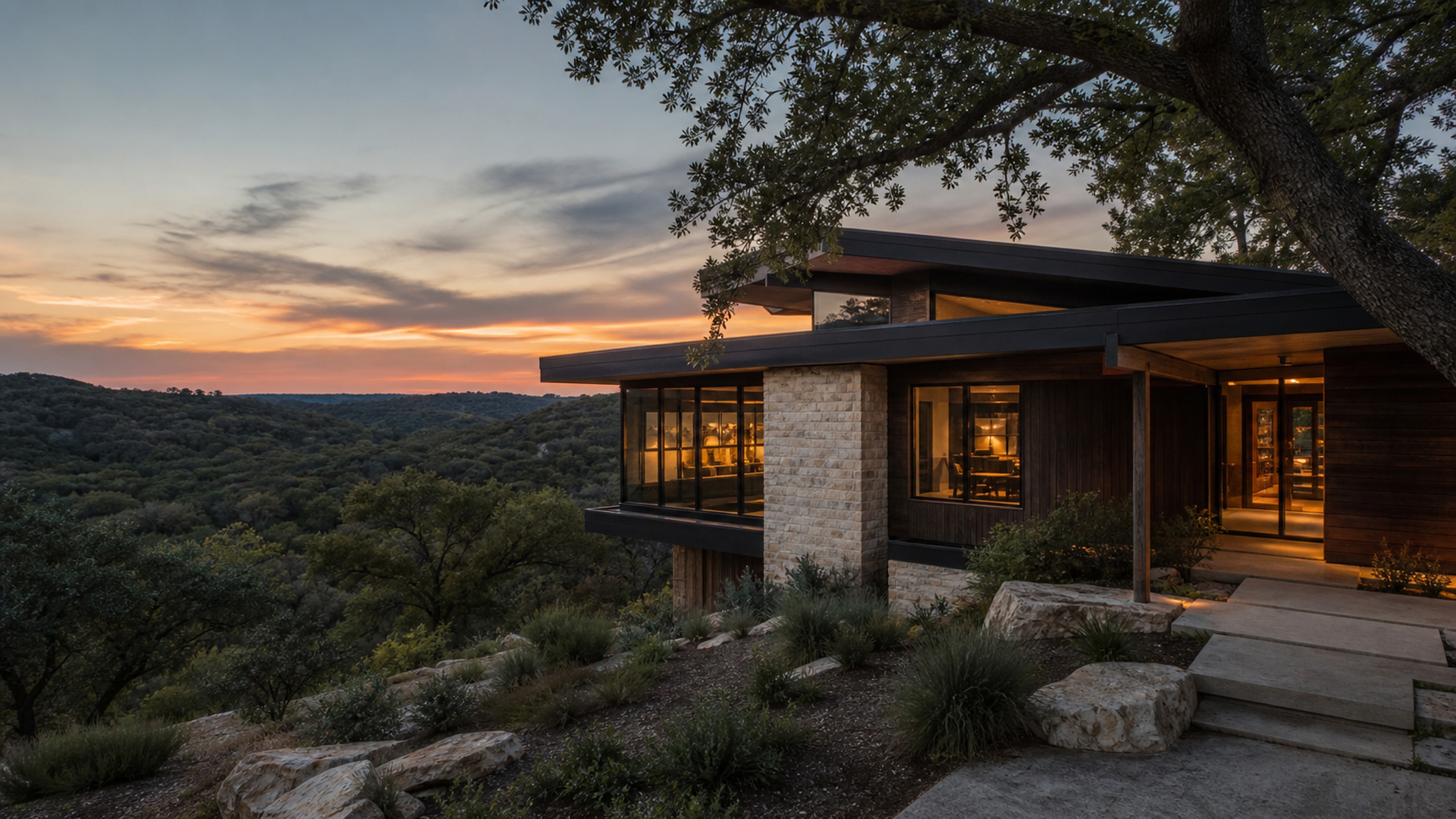 Contemporary woodland home illuminated at sunset